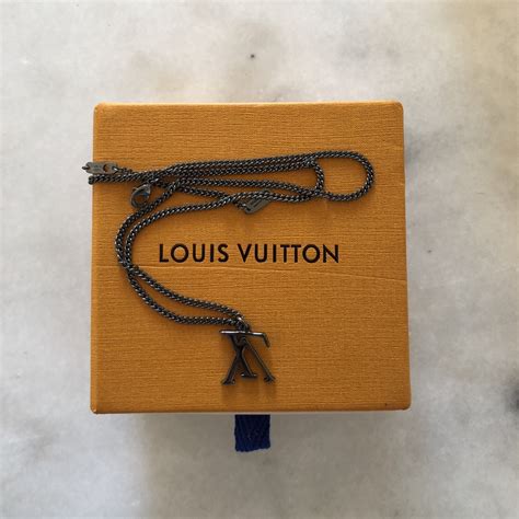 louis vuitton upside down necklace replica|false louis vuitton prints.